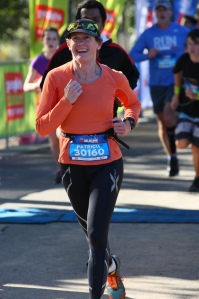 My smile is because I've just watched my son cross his first finish line!